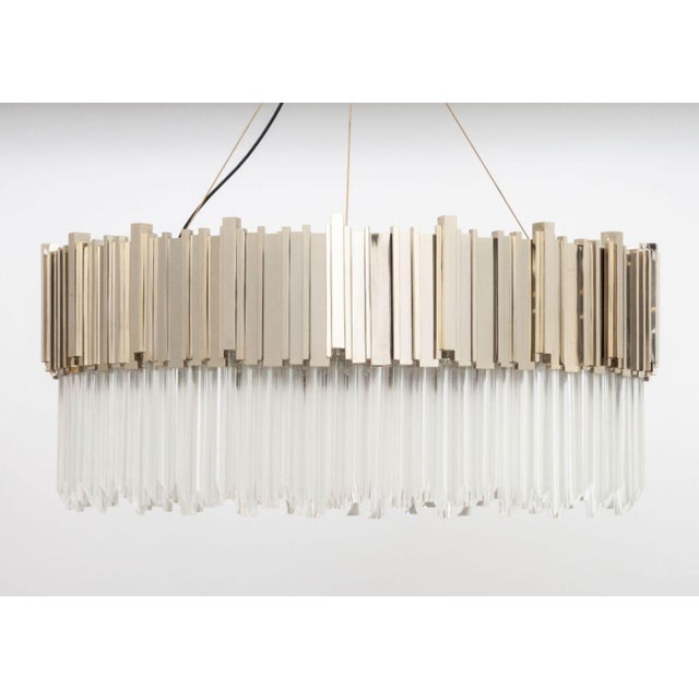 Luxxu "Empire" Suspension Chandelier, with gold-plated metal frame and two rows of crystal glass prisms. 36.5" H x 41"...