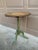 An elegant Regency-style flip-top side table in painted walnut, featuring hand-painted decoration against a green ground....