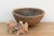 There is something deeply grounding about holding a vessel that was hewn by hand from a single block of wood. This antique...