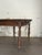 An 18th century Continental European primitive table with a single drawer and turned ring-and-reel legs. Hand cut early...