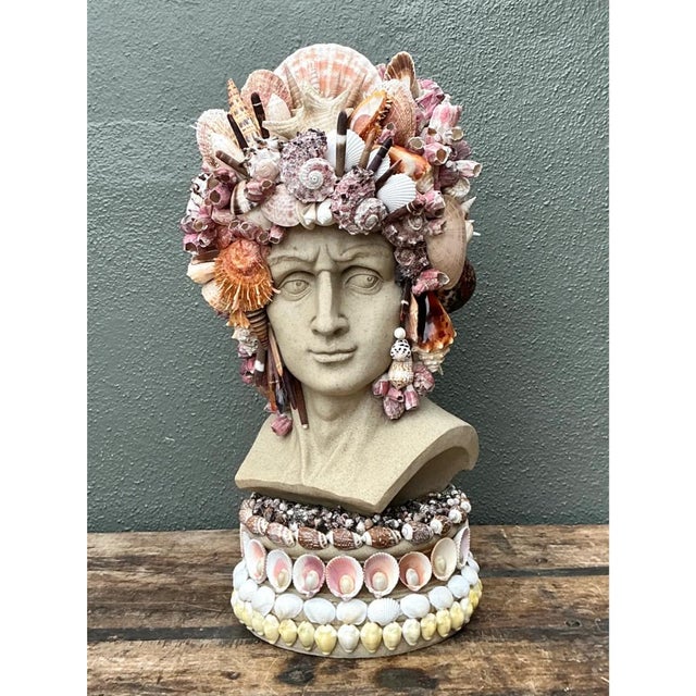 This vintage coastal decorative bust reimagines the classical reproduction form — a serene, idealized face rendered in...