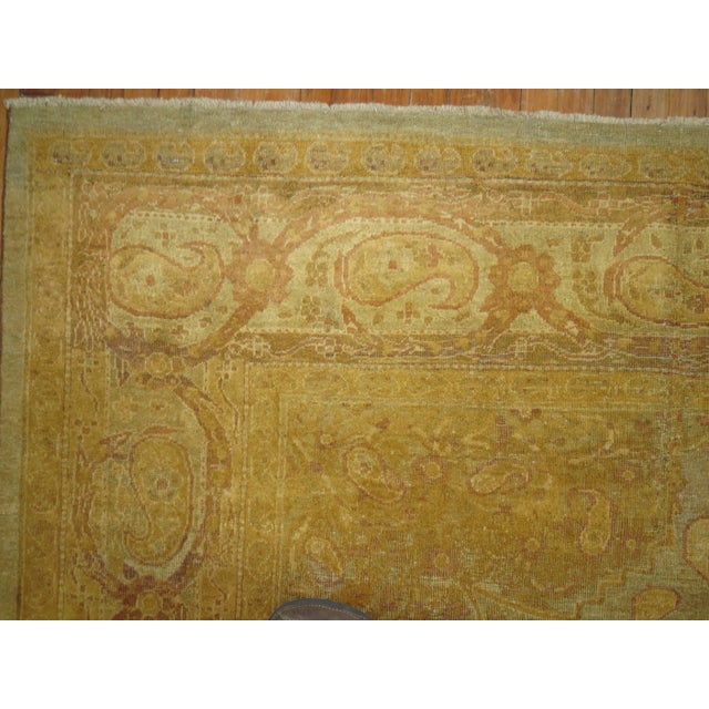A stellar late 19th century Agra carpet with slate gold, brown and lavender shades with a gorgeous central medallion and...