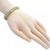 This lovely authentic bracelet is crafted from 18k yellow gold in a satin finish featuring an oval shape grooved band. It...