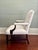 A traditional design updated with inviting upholstery, this comfortable arm chair is newly reupholstered in soft white...