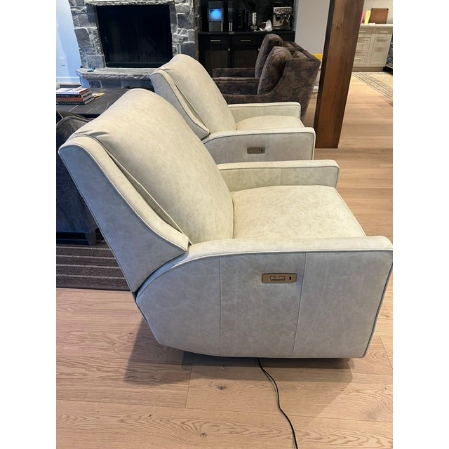 Norwalk Stephanie Swivel Reclining Chair upholstered in supple light gray leather. This sophisticated and exceptionally...