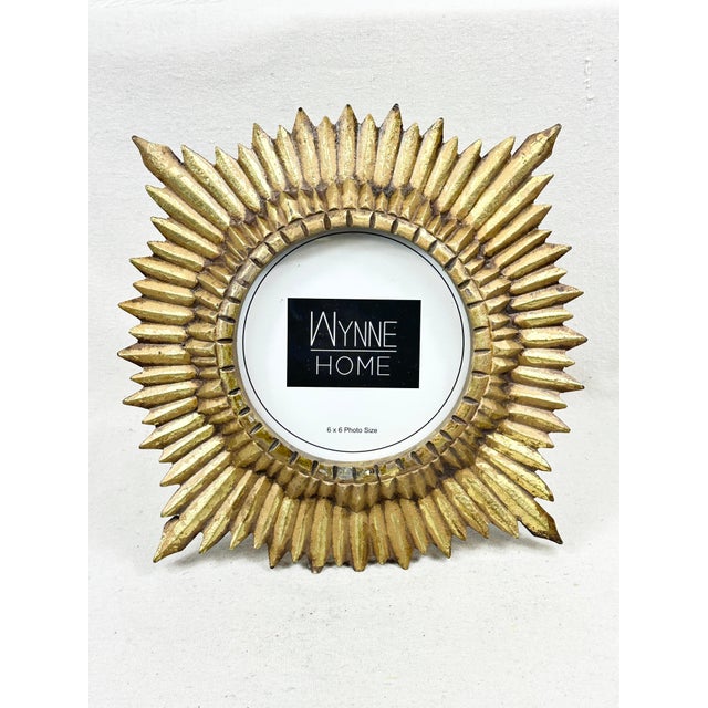Add a radiant touch of vintage glamour to your tabletop or vanity vignette with this stunning sunburst picture frame by...