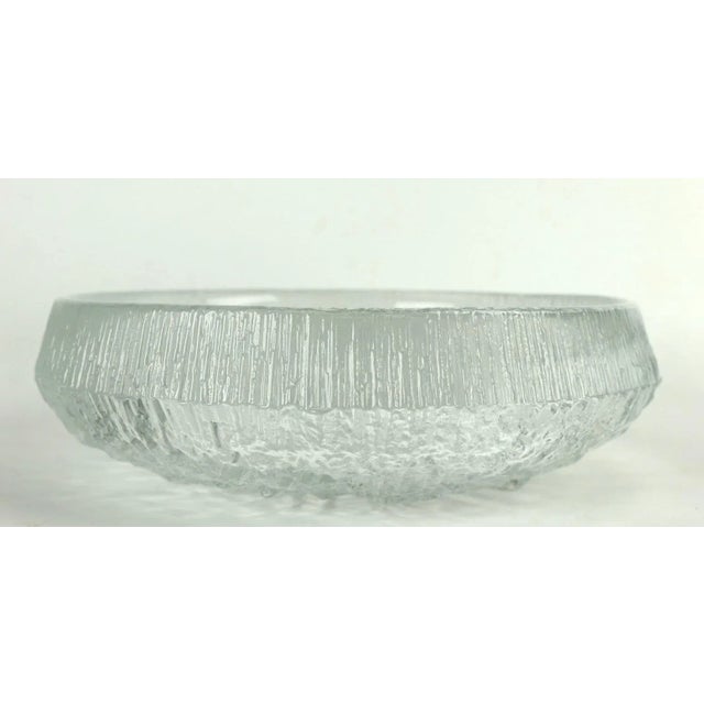 Nice center bowl designed by Tapio Wirkkala for Ittala. Clear glass with textured ice surface. Original clean and...