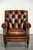 This very beautiful Chesterfield armchair, which is in good condition, is made of cowhide leather and features warm,...