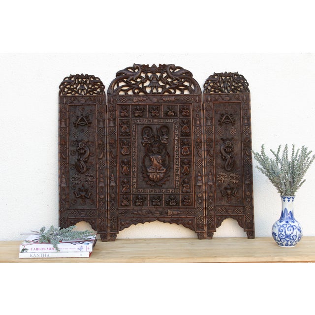 Pieces this densely carved rarely survive with every inch intact. Unfold these three panels and you're reading a full set...