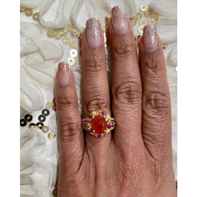 Super gorgeous and uniquely designed 4.29 Carat Fire Opal and Multicolor Sapphire and Diamond 14K Yellow Gold Cocktail...