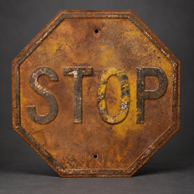 Authentic early American embossed steel STOP sign, dating approximately to the 1930s–1940s. This substantial 24-inch sign...