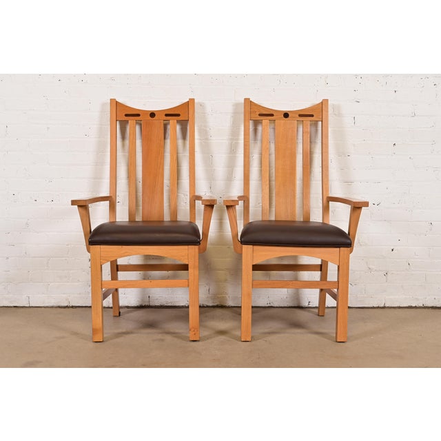 An exceptional pair of Mission or Arts & Crafts style high back armchairs or dining captain chairs In the manner of...