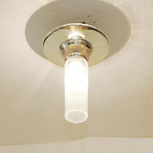 Alpaca Ceiling Lamp Art Deco ceiling lamp, circa 1920. Dish-shaped body, linear openwork opening. Alpaca silver -...