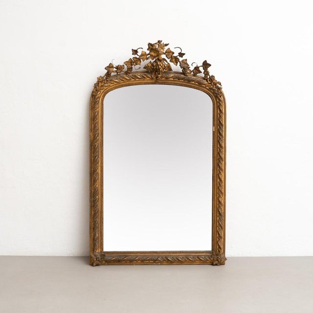 Antique Napoleon III Style Gilded Wood and Stucco Mirror, Early 20th Century Enhance your decor with the timeless...