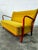 Sofa upholstered in soft mustard-colored fabric, with a beech wood frame, in perfect condition, from the 1970s....
