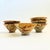 A set of 6 vintage pottery rice bowls. Earthy speckled terra cotta glazes, each with a hand painted leaf design on one...