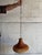 This charming pendant lamp features a textured ceramic shade and hanging chain. The warm silhouette brings cozy...