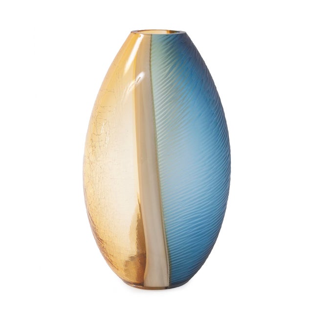 The Mirina Vase is a stunning combination of amber and blue hand blown glass, that flows together so effortlessly. It...