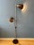 Brown mid century Anvia floor lamp with two adjustable shades. The two brown aluminium spots can be moved up and down the...