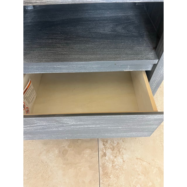Great Pottery Barn Costa Nightstand in the Brushed Charcoal finish. It features a minimalist, postmodern silhouette with a...