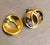 1980s-90s gold-tone blue swirl "o" stud earrings. Excellent condition.