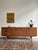 Sideboard released by the british brand avalon. the beautiful teak veneer combined with the elegant, rounded handles gives...
