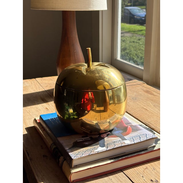 Vintage apple-shaped lidded container featuring a sculptural rounded silhouette and stem finial. This classic mid-century...