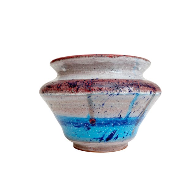 Elevate your home decor with the Artisan Signed Wheel Thrown Pottery Colorful Vase by Trina Reyes, crafted in 1984. This...