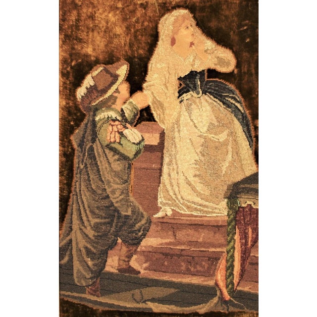 An antique framed Spanish beaded embroidery with petite point. Image depicts a Spanish couple in costume on stairs....