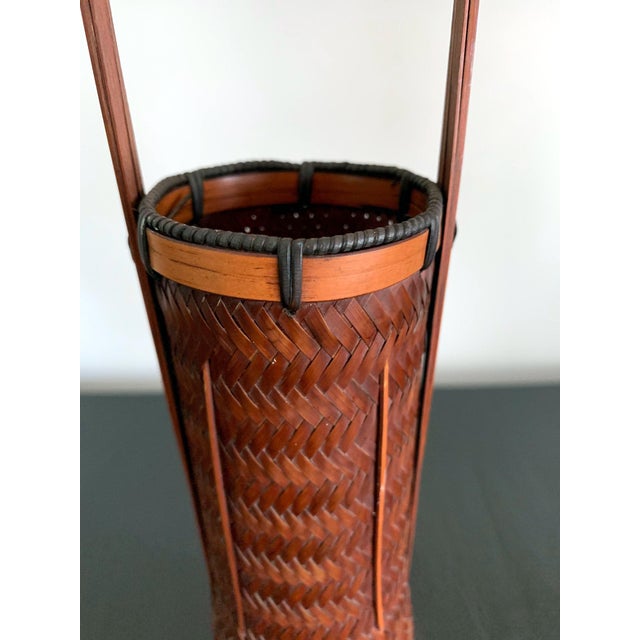 A vintage Japanese ikebana made from lacquered bamboo basketry circa first half of the 20th century. This piece of bamboo...