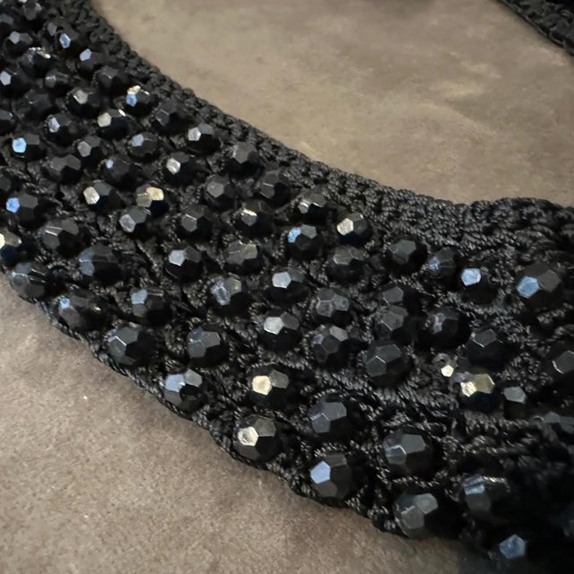 This rare 1930s Italian multi-strand necklace is a masterwork of Art Deco craftsmanship, featuring a dense weave of jet-...