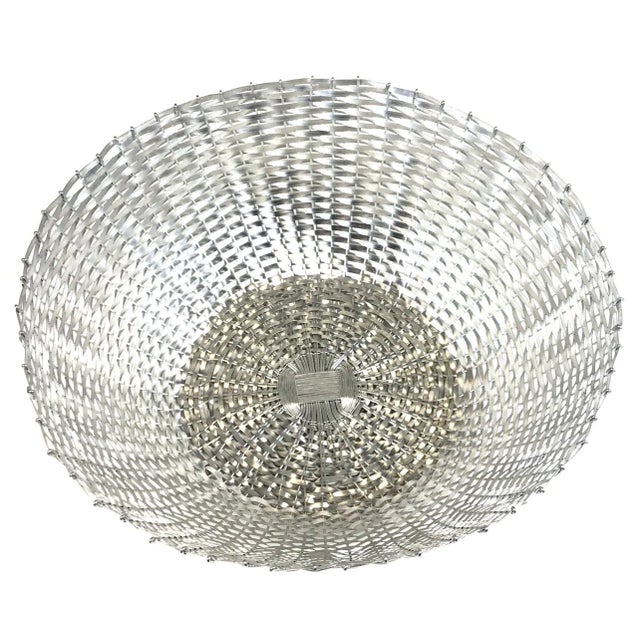 Very cool and unique extremely large basket bowl made from woven aluminum metal. Use this basket for fruit and veggies or...