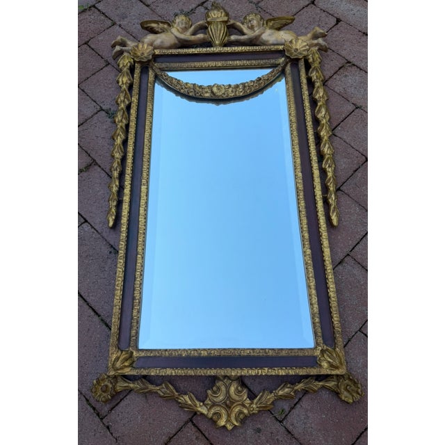 Absolutely beautiful hand carved mahogany mirror expertly crafted by and produced by the Carver’s Guild in the early 1990s...