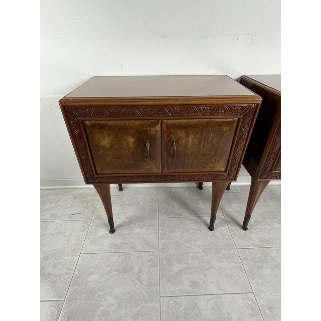 Set of 2 Mid-Century Italian Design bedside tables from the 1950s Wooden structure with colored glass top. Compartment...