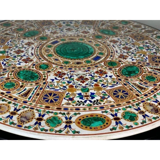 Pietra Dura Empire table. Malachite, amethyst, lapis lazuli, citrine and sienna marble inlaid in white marble. Wood is...