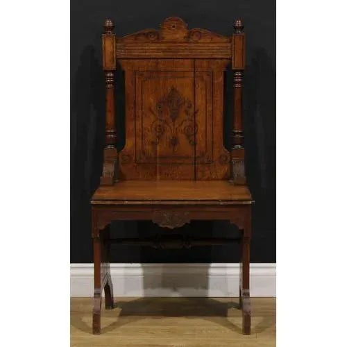 A pair of handsome circa 1890 English Arts & Crafts oak entrance hall chairs, incise carved with Aesthetic Movement...