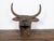 This English cast iron bull wall hanging sculpture, dating back to circa 1930-1940, presenting large antlers and a rustic,...