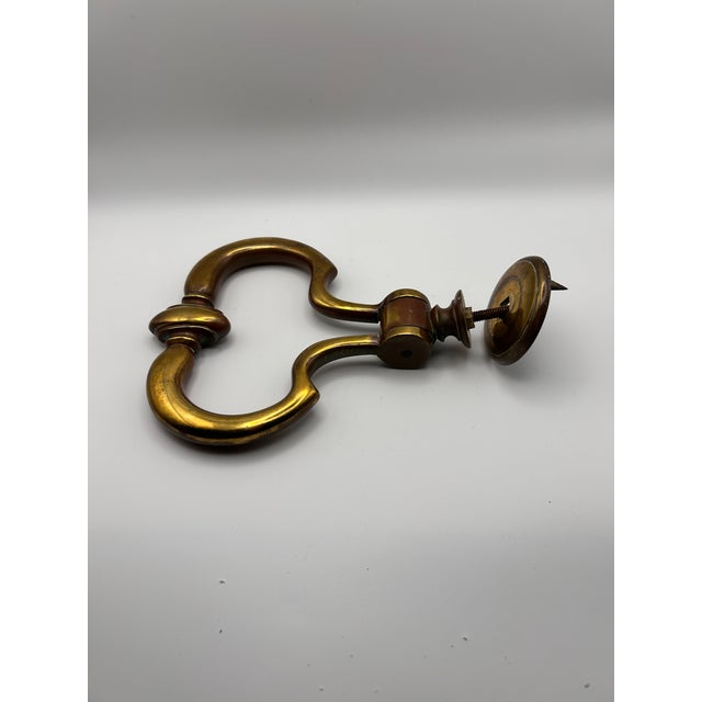 Sourced in England, this large, heavy brass knocker dates from the Victorian age. Includes mounting screw.