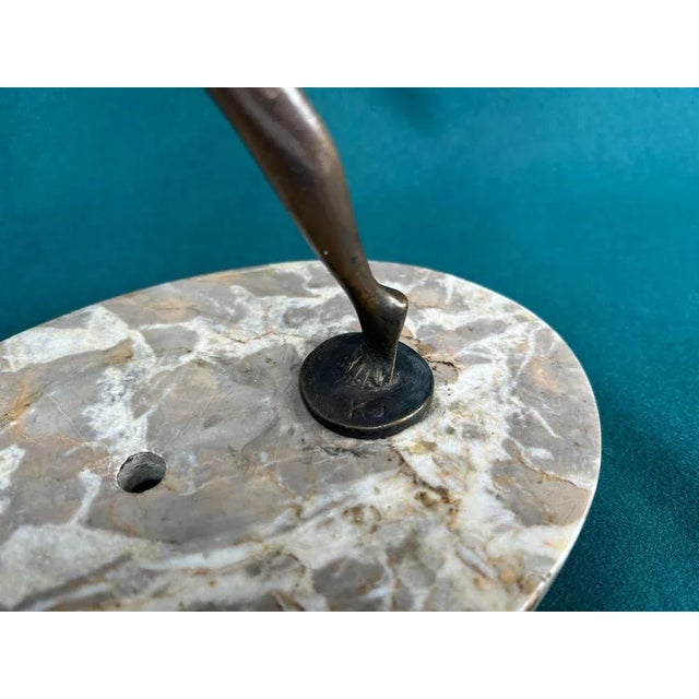 Art deco bronze dancing girl on marble base, signed KJ.