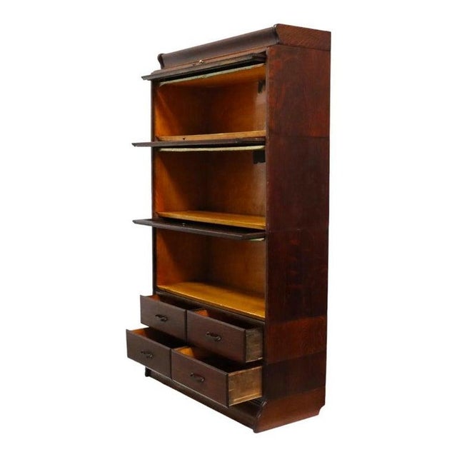 This antique Arts & Crafts barrister bookcase, crafted by the Camden Cabinet Co., dates to approximately 1920. Constructed...