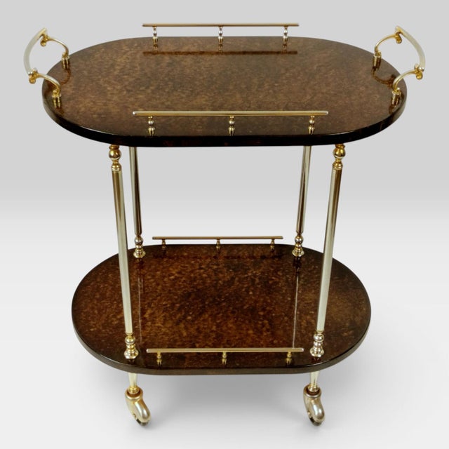 An exceptional Italian Mid-Century Modern bar cart / serving trolley from the 1960s. This luxurious piece of Italian...