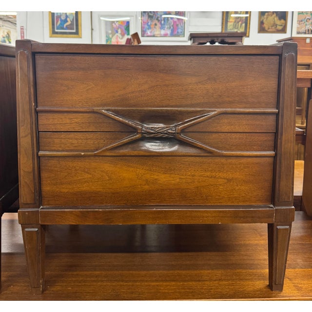 Enhance your bedroom with this beautiful pair of Mid-Century Modern walnut nightstands by Hoke Wood Products, expertly...