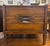 Enhance your bedroom with this beautiful pair of Mid-Century Modern walnut nightstands by Hoke Wood Products, expertly...