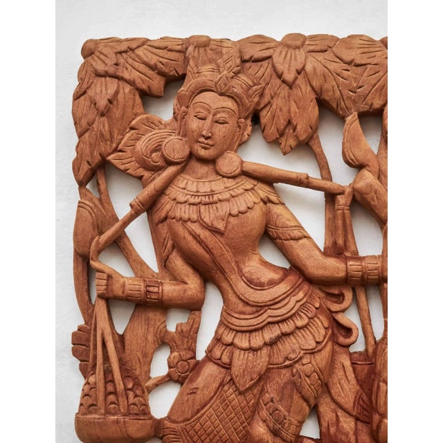 Picture panel carved from exotic wood. Sculpture with motifs of women at work surrounded by plant motifs. Condition: very...