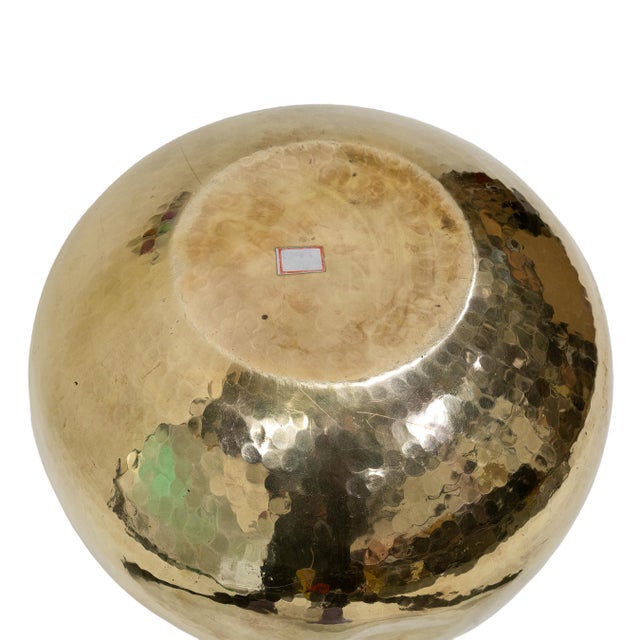 This handcrafted raised brass vessel has a graceful traditional form and light hammered texture. Wide hammered rim and...