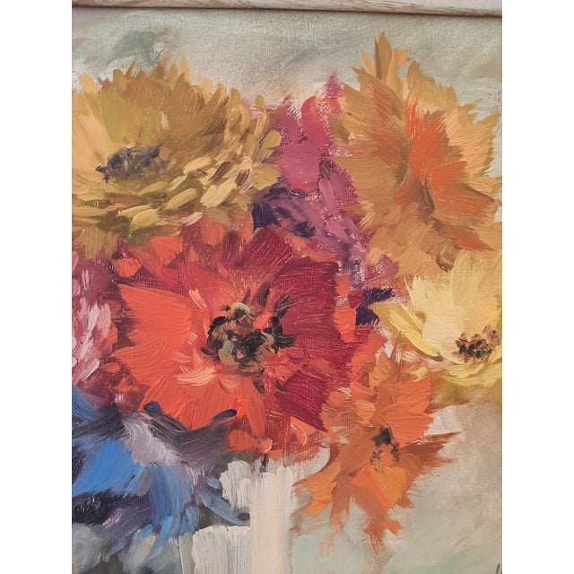 This is a beautiful vintage mid-century still life floral painting, signed by the artist and presented in its original...