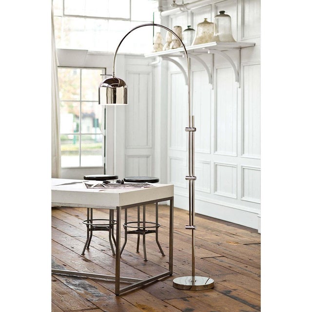 The uniformed metallic base and shade of this adjustable floor lamp offers a sleek, modern installment for any room.