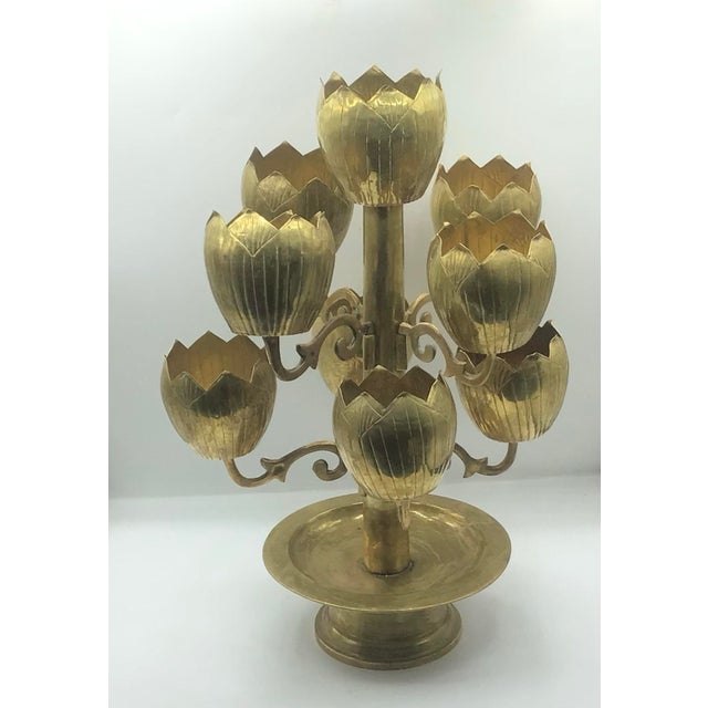 Rare Nine lotus shaped candle holder to elevate the design status of your living space. This vintage candelabra will...
