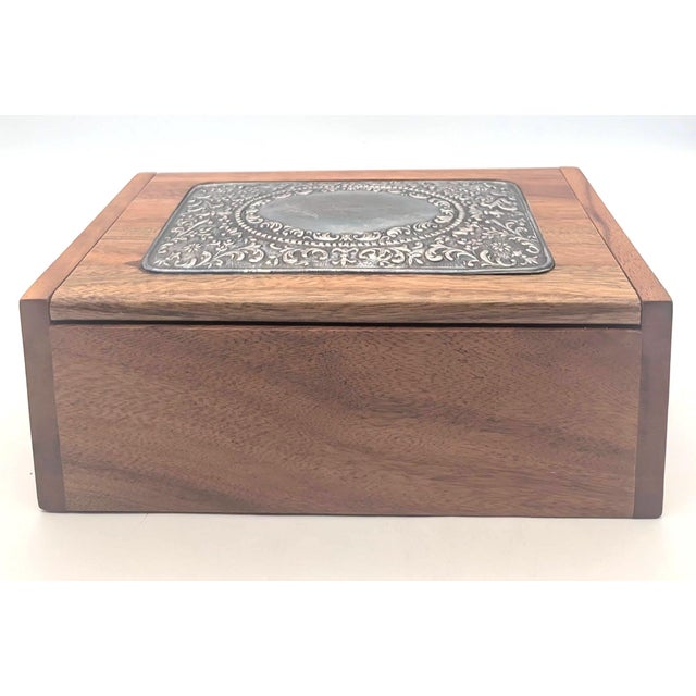 Offered is a handcrafted wooden jewelry or trinket box with three interior partitions featuring an ornate .925 sterling...