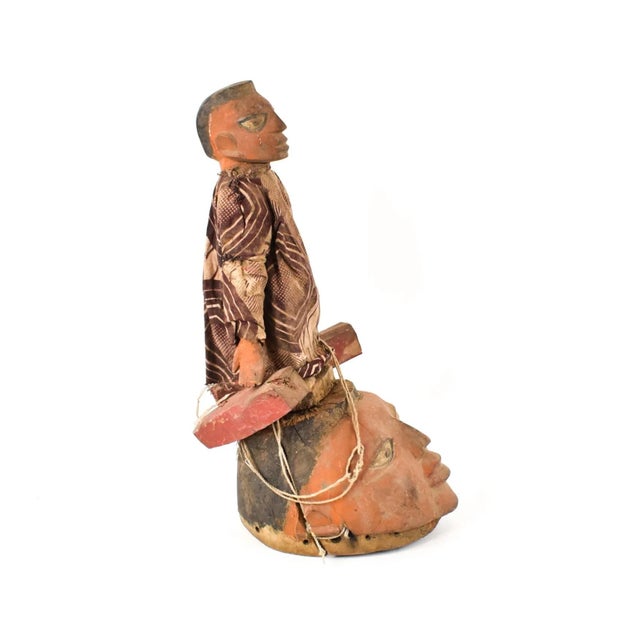 The Gelede mask, originating from the Yoruba people living along the southwestern Nigerian and Beninese border, showcases...